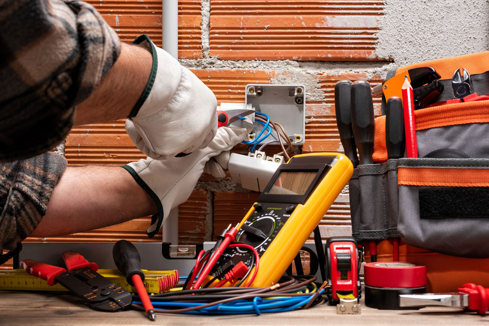 Electrician in Rifle, CO Stripping Wires